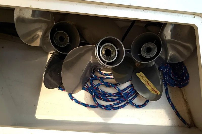 Slide: The Image of Propellers and rope stored in a compartment of a 2000 Boston Whaler 28 Outrage boat. - 50