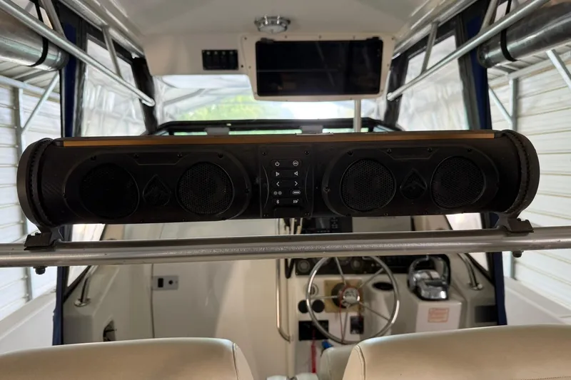 Slide: The Image of Interior of a 2000 Boston Whaler 28 Outrage with mounted audio system. - 54