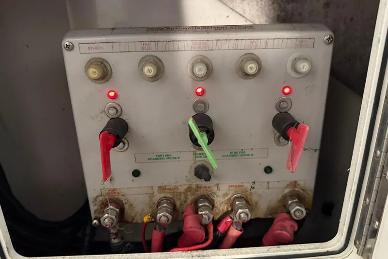 Slide: The Image of Electrical panel on a 2000 Boston Whaler 28 Outrage boat with switches and indicators. - 58