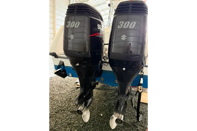 Slide: The Image of Twin Suzuki 300 outboard engines on a 2000 Boston Whaler 28 Outrage boat. - 8
