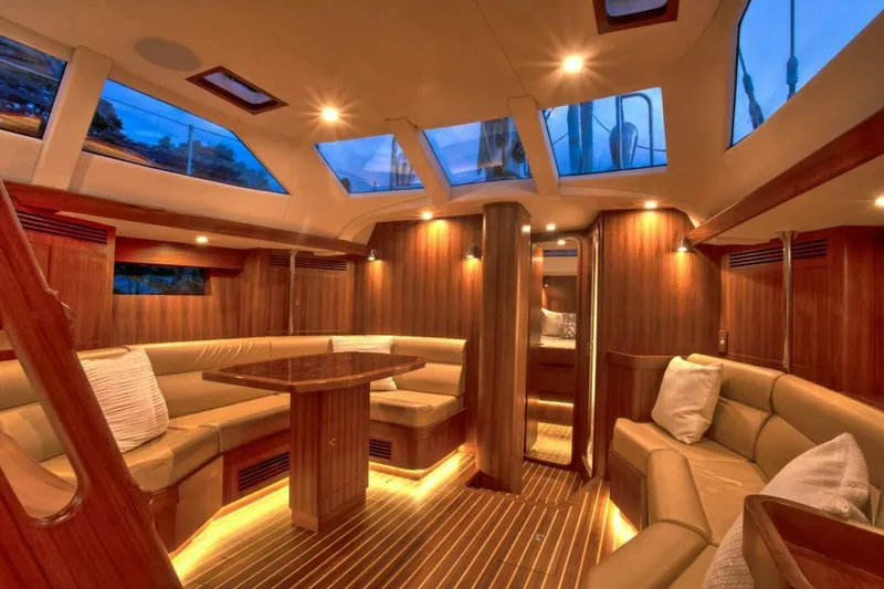 Slide: The Image of Luxurious interior of 2025 Hylas H48 yacht with elegant wood finish and plush seating. - 13