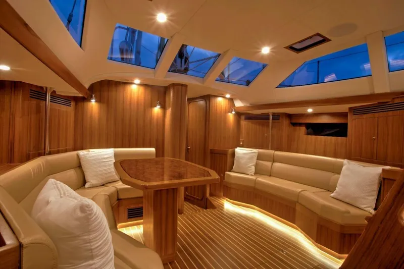Slide: The Image of Luxurious interior of 2025 Hylas H48 yacht with elegant wood finish and plush seating. - 15