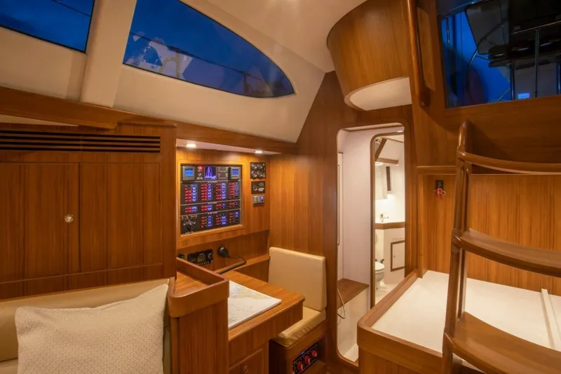 Slide: The Image of Luxurious interior of 2025 Hylas H48 yacht with wood finish and modern navigation panel. - 17