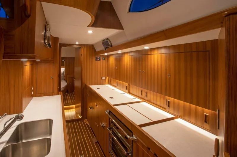 Slide: The Image of Luxurious interior of 2026 Hylas H48 yacht with modern kitchen design. - 24