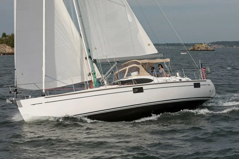 Slide: The Image of 2025 Hylas H48 sailboat navigating ocean waters with two people onboard. - 4