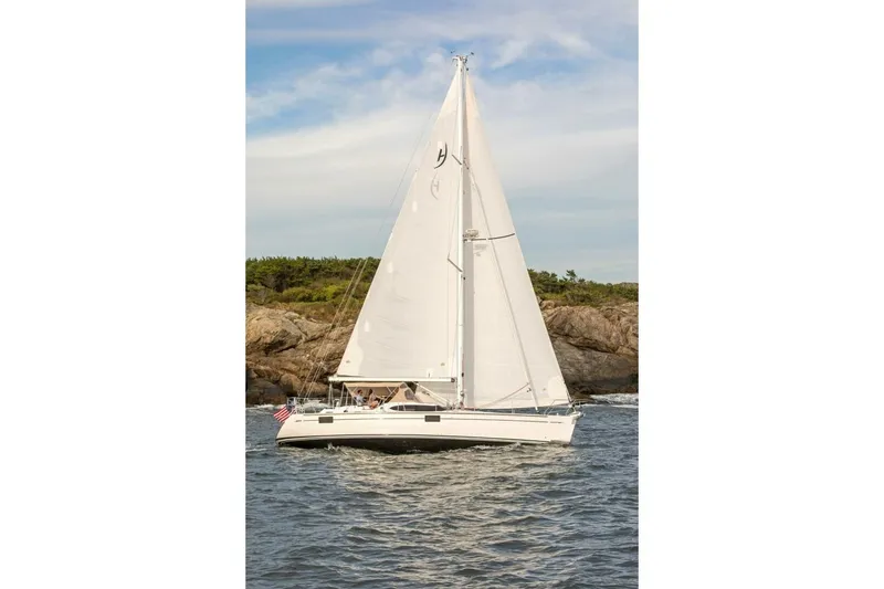 Slide: The Image of Sailing yacht Hylas H48 2025 on the water near rocky coastline. - 5