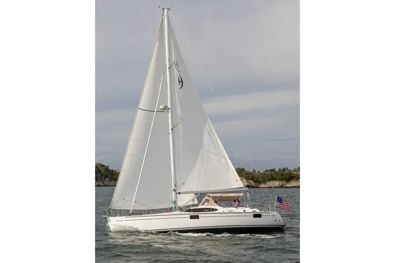 Slide: The Image of Sailing yacht Hylas H48 2025 on open water with American flag. - 6