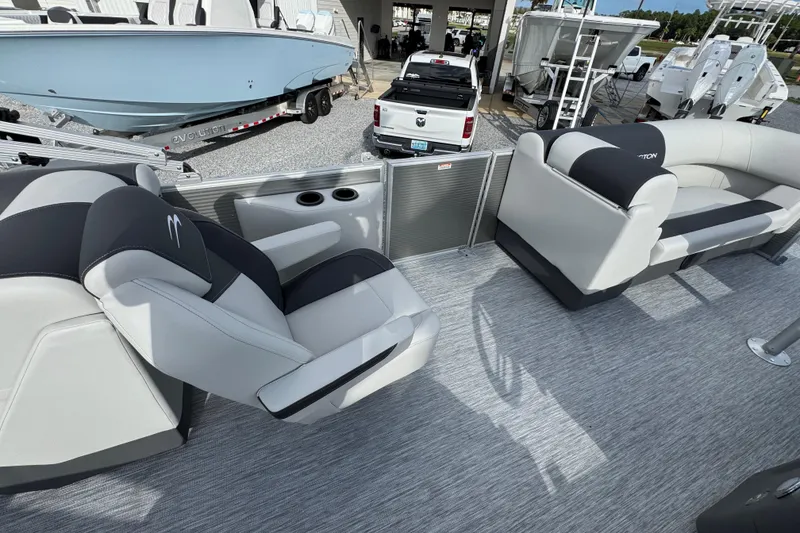 Slide: The Image of 2026 Bennington 22 SSR pontoon boat interior with plush seating and cup holders. - 20