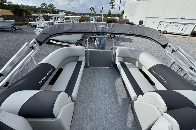 Slide: The Image of 2026 Bennington 22 SSR pontoon boat with spacious seating and sleek design. - 22