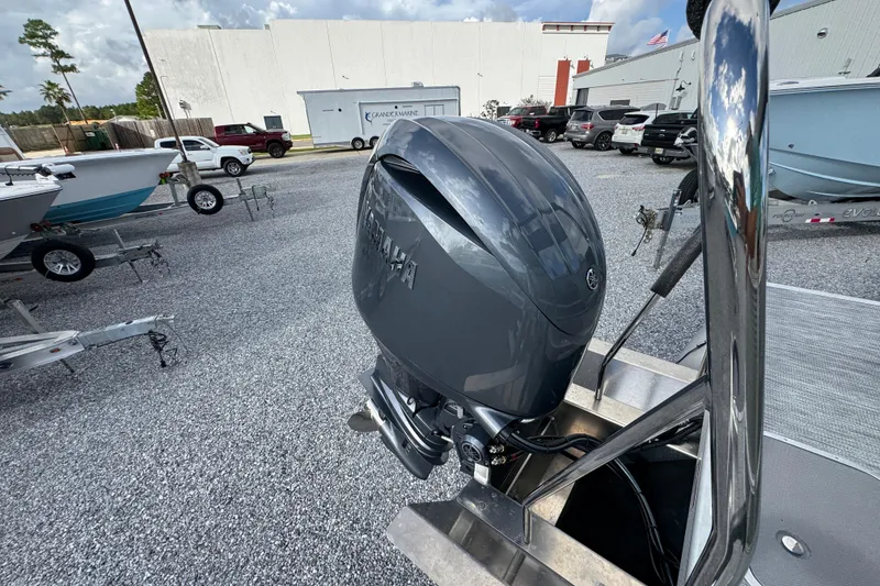 Slide: The Image of 2026 Bennington 22 SSR boat with Yamaha outboard motor in a dealership lot. - 26