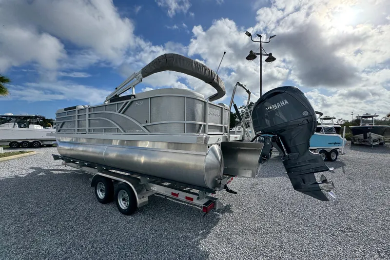 Slide: The Image of 2026 Bennington 22 SSR pontoon boat with Yamaha outboard motor on a trailer. - 3
