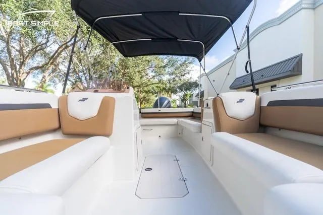 Slide: The Image of 2021 Starcraft SVX 191 OB boat interior with tan seating and black canopy. - 7