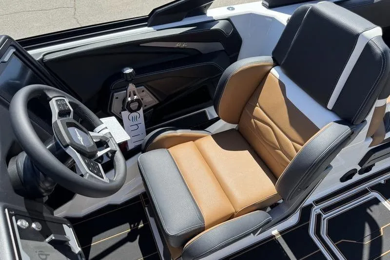 Slide: The Image of Interior of 2025 Supra SE 575 boat with luxury seating and modern steering wheel. - 4