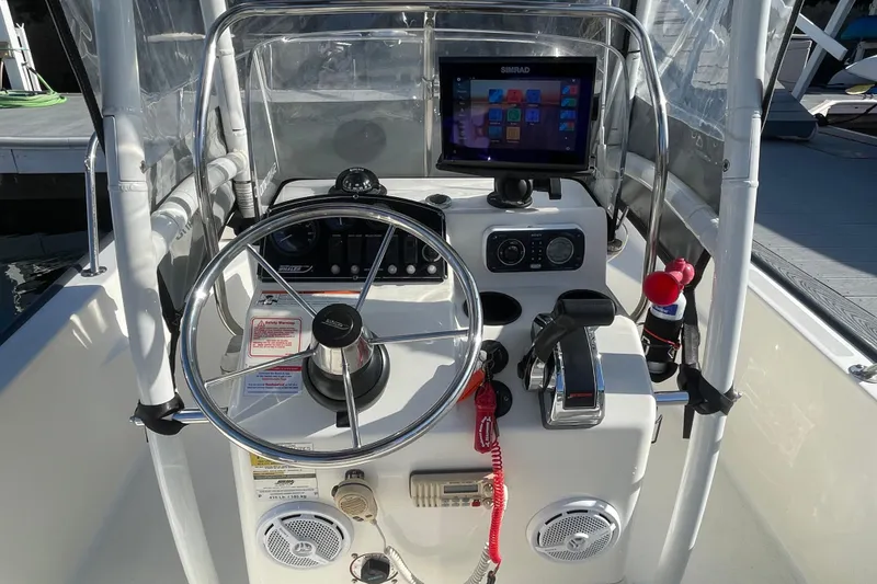 Slide: The Image of 2006 Boston Whaler 170 Montauk boat console with steering wheel and navigation system. - 10