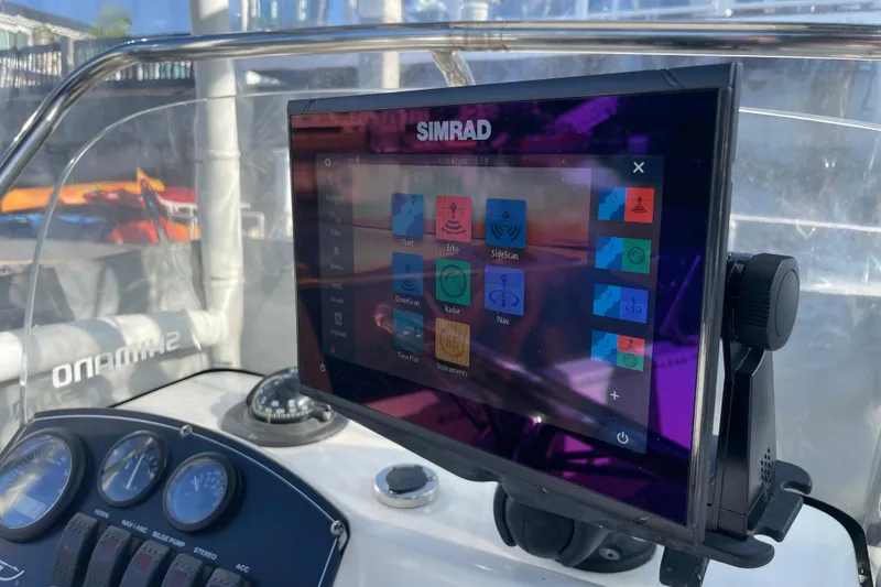 Slide: The Image of Simrad navigation system on 2006 Boston Whaler 170 Montauk boat dashboard. - 12