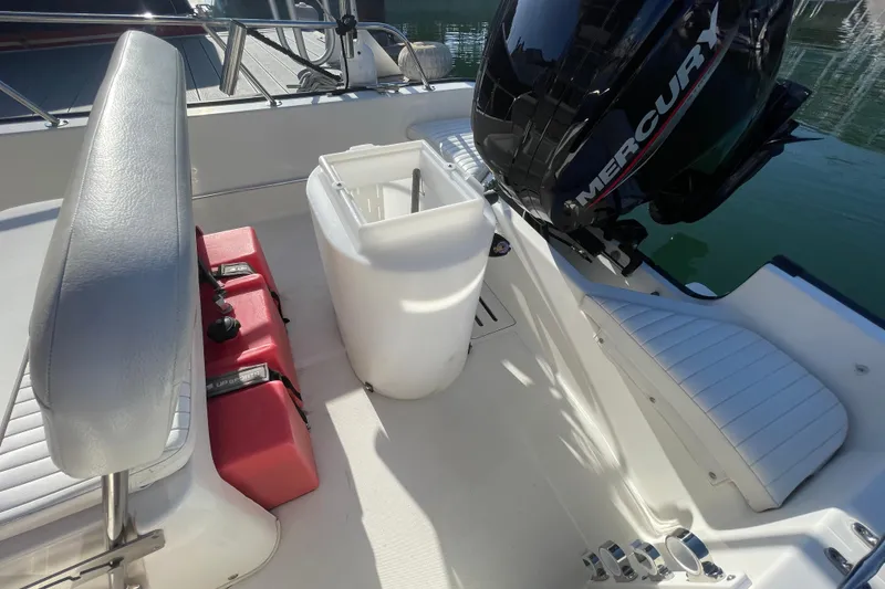 Slide: The Image of 2006 Boston Whaler 170 Montauk interior with Mercury engine and seating. - 15