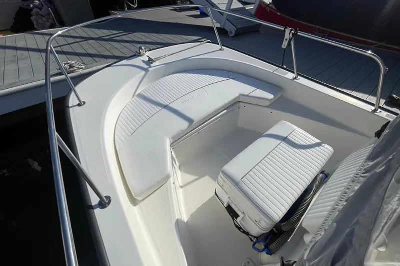 Slide: The Image of 2006 Boston Whaler 170 Montauk boat interior with seating and storage. - 16