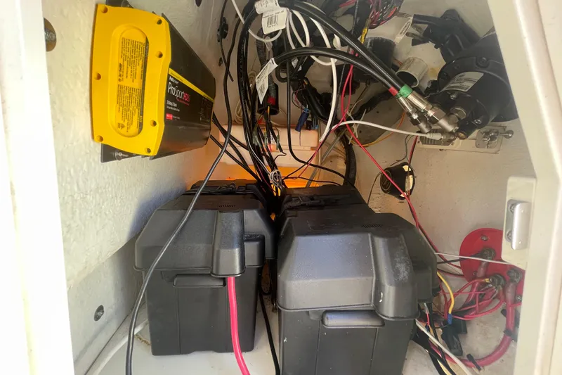 Slide: The Image of Electrical components and wiring inside a 2006 Boston Whaler 170 Montauk boat. - 17