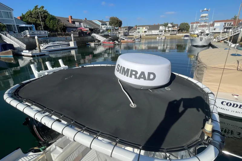 Slide: The Image of Boston Whaler 170 Montauk 2006 with Simrad radar in a marina setting. - 19