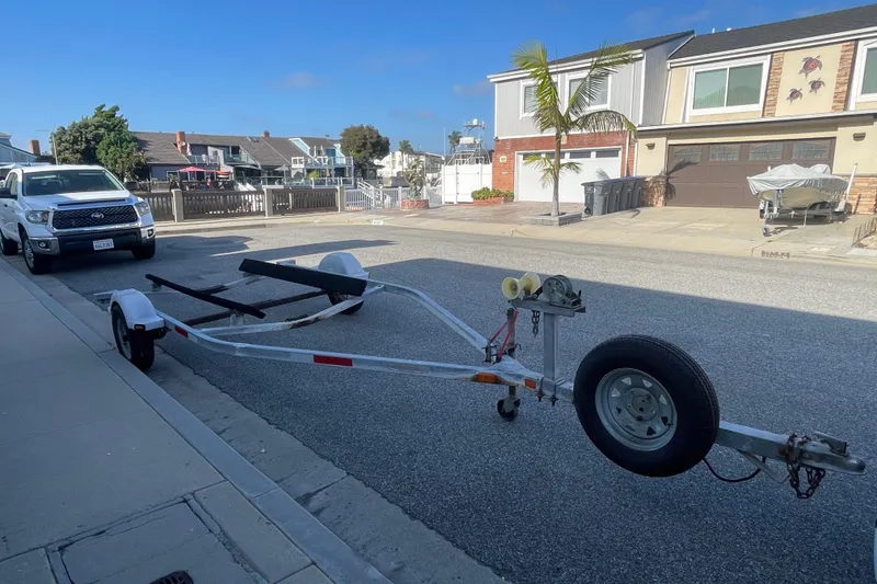 Slide: The Image of Empty boat trailer on street, suitable for 2006 Boston Whaler 170 Montauk. - 23