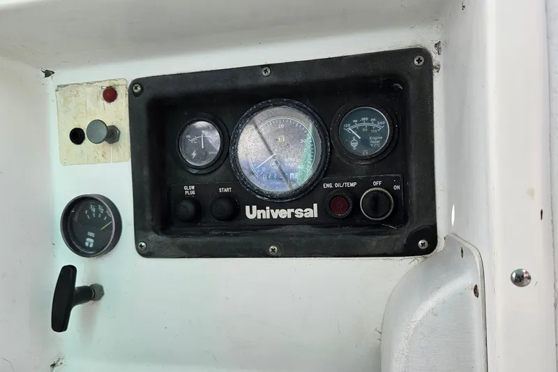 Slide: The Image of Control panel of a 1987 Tartan 37 sailboat with gauges and switches. - 15