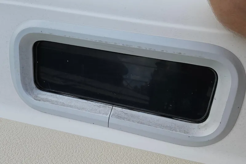 Slide: The Image of Portlight window on a 1987 Tartan 37 sailboat, showcasing sleek design. - 16