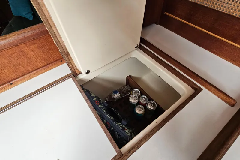 Slide: The Image of Hidden storage compartment in 1987 Tartan 37 sailboat with drinks and supplies. - 33