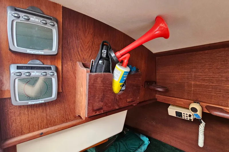 Slide: The Image of Interior of 1987 Tartan 37 sailboat with navigation instruments and safety equipment. - 37