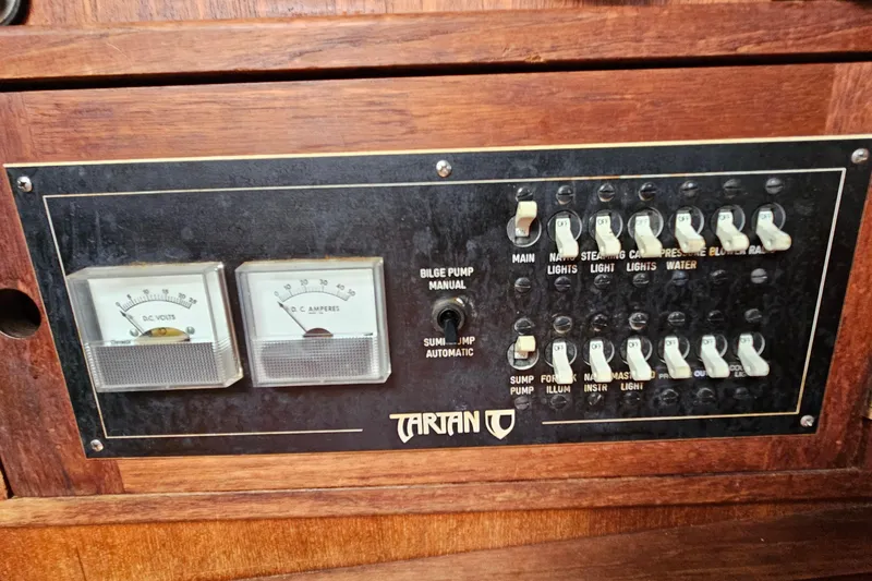 Slide: The Image of Control panel of a 1987 Tartan 37 sailboat with switches and gauges. - 40