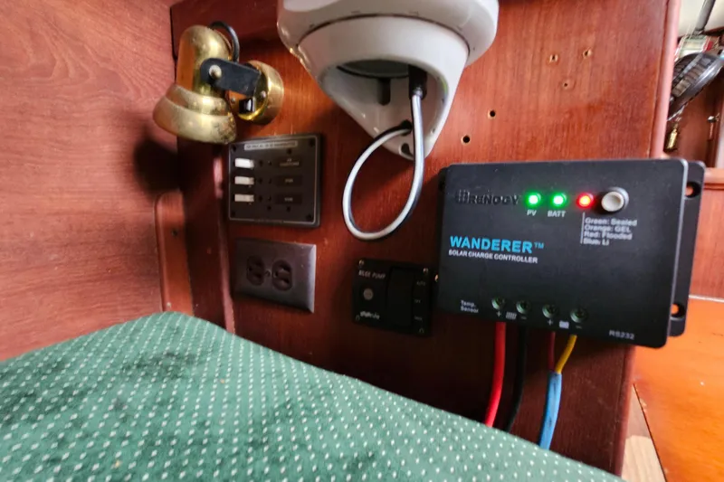 Slide: The Image of Interior of 1987 Tartan 37 with solar charge controller and electrical panel. - 41