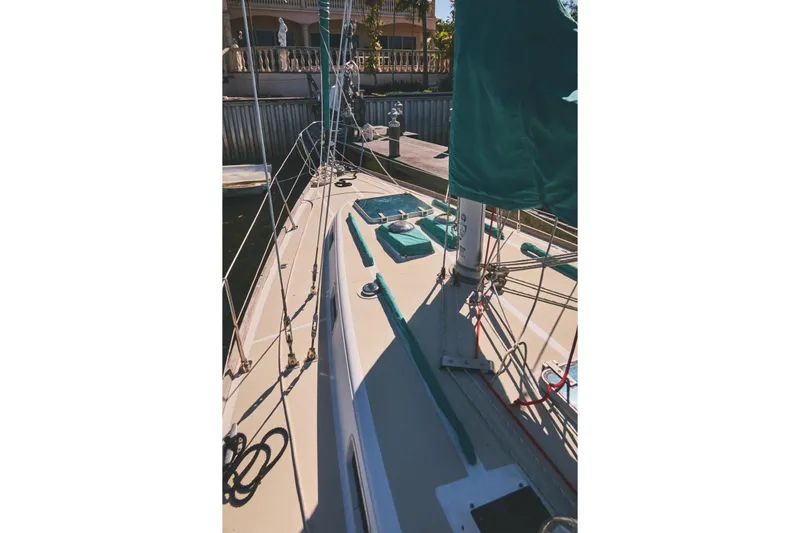 Slide: The Image of 1987 Tartan 37 sailboat deck with rigging and green sail cover. - 5
