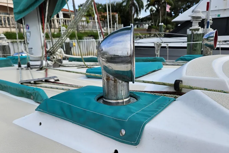 Slide: The Image of 1987 Tartan 37 sailboat deck with chrome vent and teal canvas covers. - 7