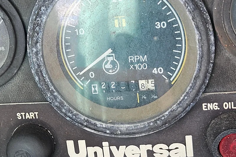 Slide: The Image of Close-up of a Universal tachometer on a 1987 Tartan 37 boat. - 79