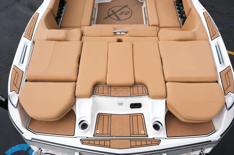 Slide: The Image of 2019 MasterCraft X22 boat with tan seating and sleek design. - 14