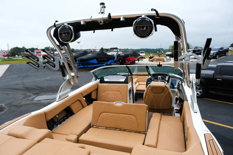 Slide: The Image of 2019 MasterCraft X22 boat interior with tan seating and advanced audio system. - 25