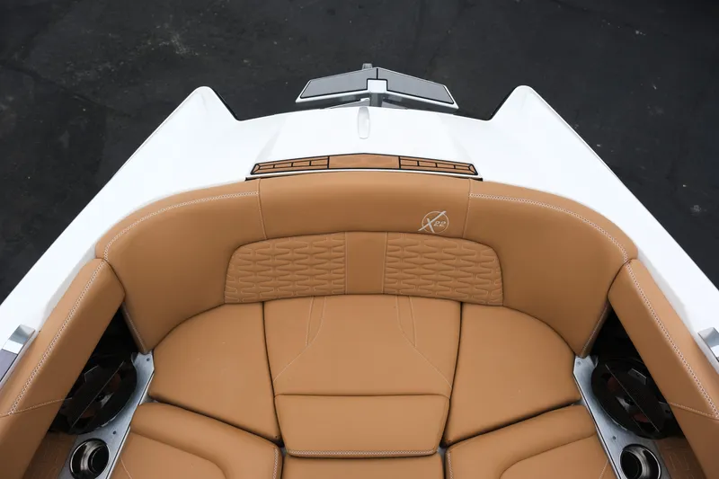 Slide: The Image of 2019 MasterCraft X22 boat interior with tan leather seating and sleek design. - 29