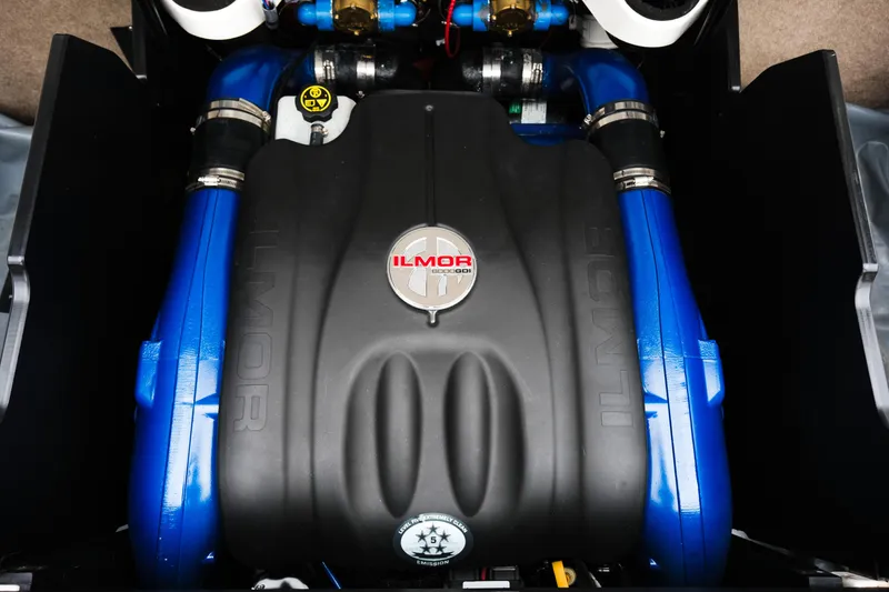 Slide: The Image of 2019 MasterCraft X22 Ilmor engine with blue accents and branded cover. - 30