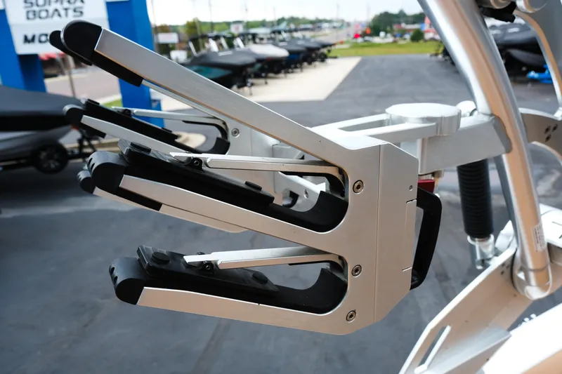 Slide: The Image of 2019 MasterCraft X22 boat wakeboard rack, close-up view at a dealership. - 31