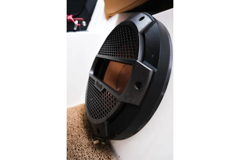 Slide: The Image of Close-up of a speaker on a 2019 MasterCraft X22 boat interior. - 35