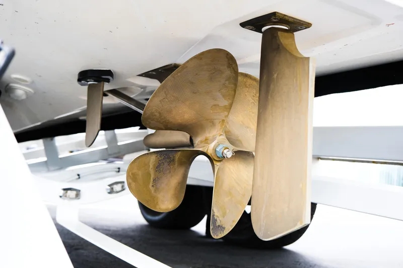 Slide: The Image of Close-up of 2019 MasterCraft X22 boat propeller and rudder system. - 9