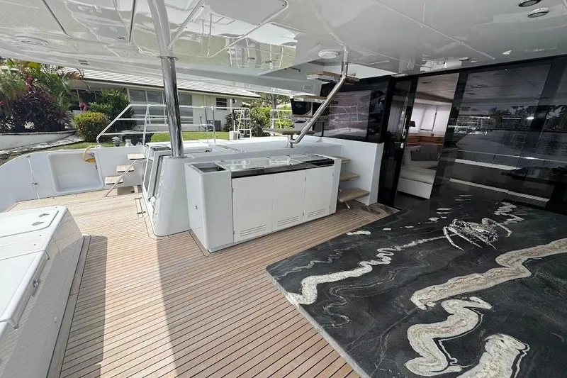 Slide: The Image of Luxurious 2015 Lagoon Motor Yacht deck with sleek design and modern amenities. - 13