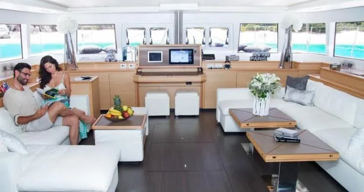 Slide: The Image of Luxurious interior of 2015 Lagoon Motor Yacht with modern furnishings and panoramic windows. - 16