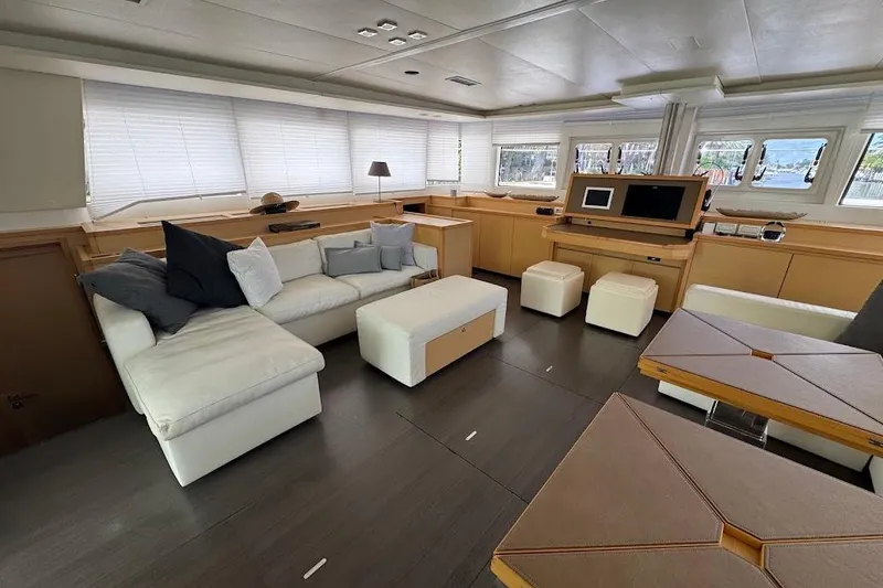 Slide: The Image of Luxurious interior of a 2015 Lagoon Motor Yacht with modern furnishings and ample natural light. - 19