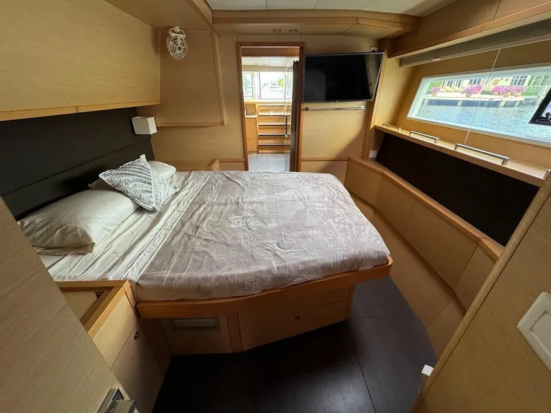 Slide: The Image of Luxurious bedroom interior of 2015 Lagoon Motor Yacht with modern amenities and large window. - 24