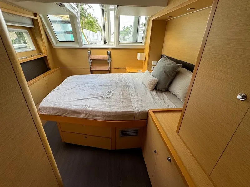 Slide: The Image of Luxurious 2015 Lagoon Motor Yacht bedroom with modern design and large windows. - 26