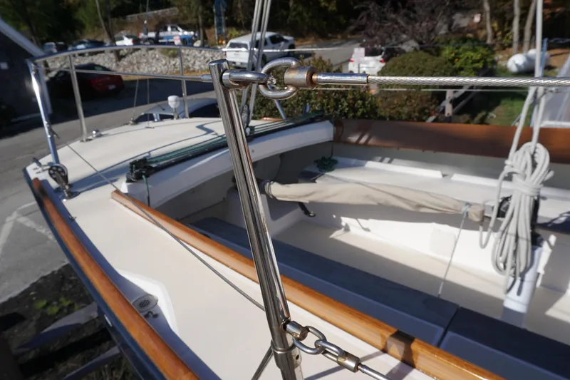 Slide: The Image of 2006 Alerion Express 28 sailboat deck with rigging and wooden trim. - 17