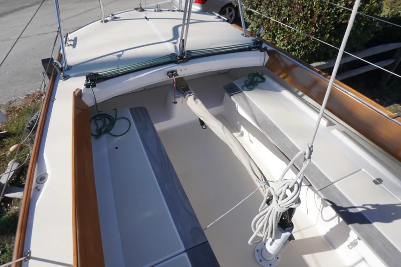 Slide: The Image of 2006 Alerion Express 28 sailboat cockpit with ropes and wooden trim. - 18