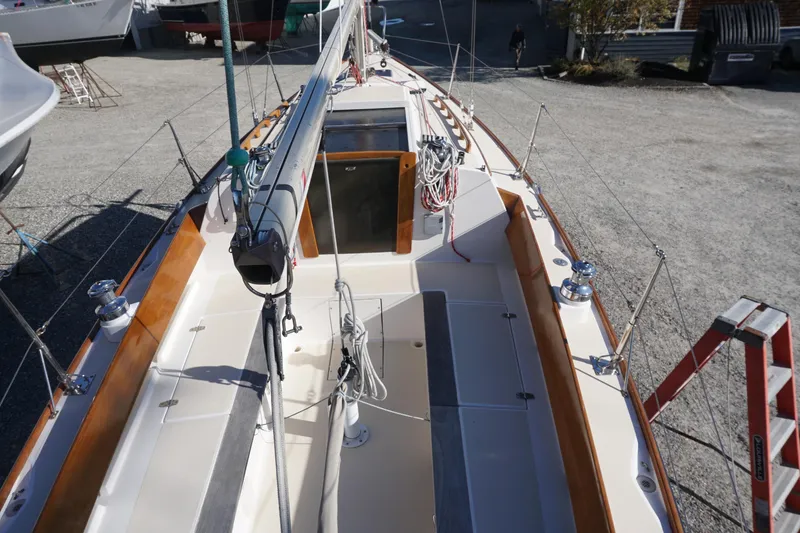 Slide: The Image of 2006 Alerion Express 28 sailboat deck with wooden trim and rigging details. - 25