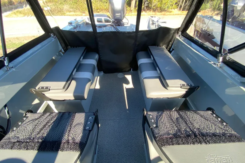 Slide: The Image of 2026 Hewescraft 180 Sportsman interior with seating and storage, showcasing spacious design. - 10