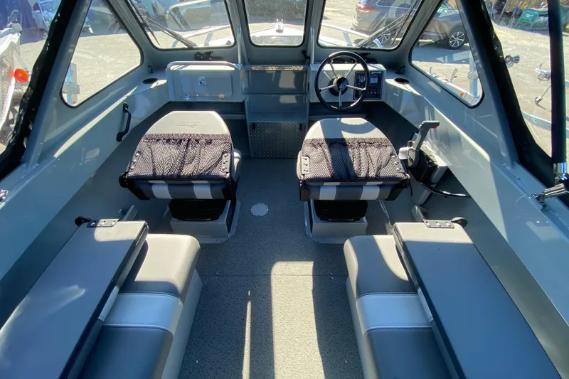 Slide: The Image of Interior of 2026 Hewescraft 180 Sportsman boat with seating and steering wheel. - 5
